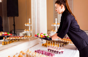 How to reduce food and beverage costs at your European wedding A caterer providing desserts for a wedding.